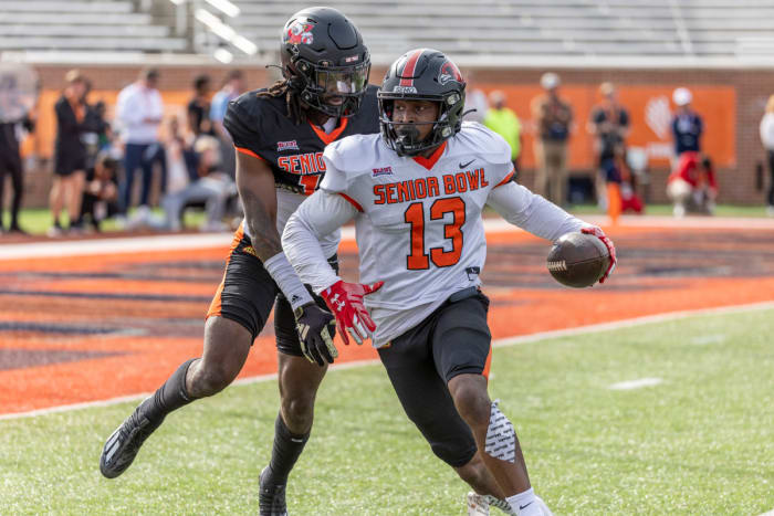 Feb 1, 2024; Mobile, AL, USA; American wide receiver Ryan Flournoy of Southeast Missouri (13) turns to the end zone after a pass catch against American defensive back Jarvis Brownlee Jr of Louisville (19) during practice for the American team at Hancock Whitney Stadium.